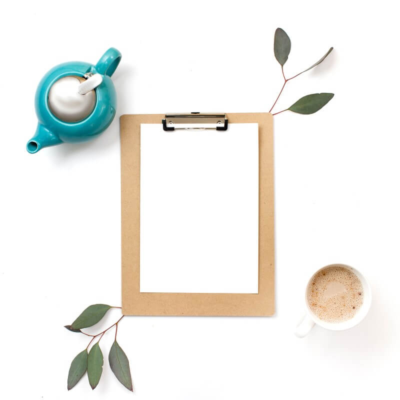 Copywriting and email marketing for your website. Teapot and teacup with blank paper on clipboard